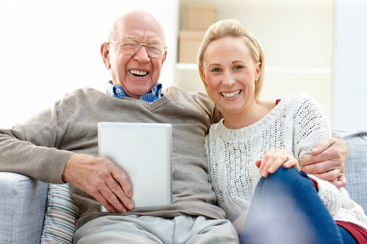 National Dementia Carers Day Carer and elderly man smiling
