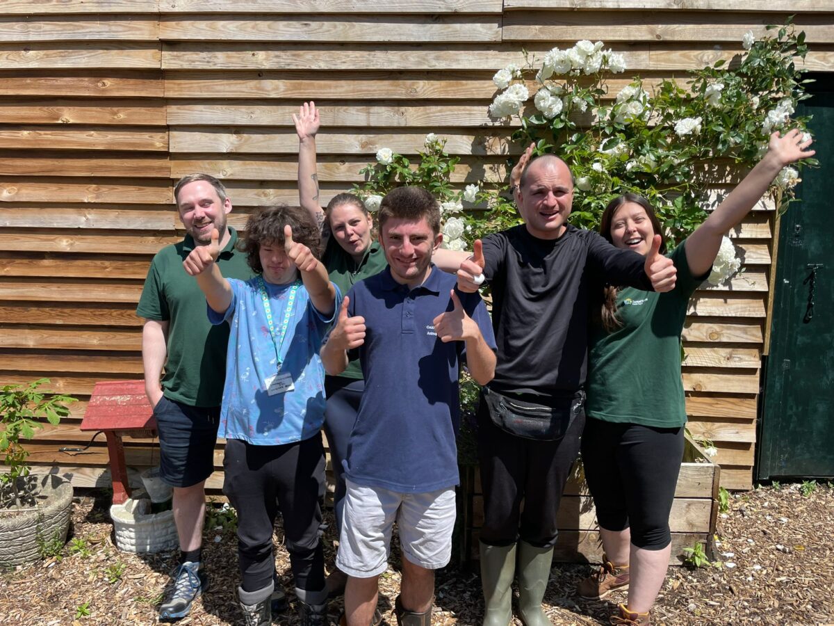 The winners celebrate with their support workers at SweetTree fields Farm, from left, Thomas, Jonathan, Christy, Bastian, Francesco and Jade.